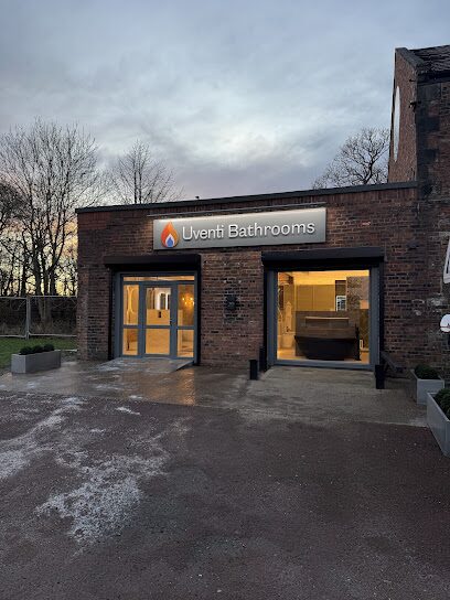 The Uventi Bathrooms showroom entrance at Backworth Studios, a converted brick unit with an illuminated sign